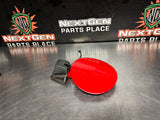 2004 PONTIAC GTO FUEL GAS DOOR ASSEMBLY TORRID RED OEM 92119899 #1027