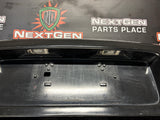 04-06 PONTIAC GTO LICENSE PLATE TRUNK FILLER PANEL BLACK OEM #3939
