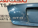 04-06 PONTIAC GTO LICENSE PLATE TRUNK FILLER PANEL BARBADOS BLUE OEM #693