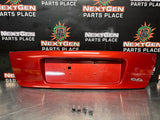 04-06 PONTIAC GTO LICENSE PLATE TRUNK FILLER PANEL SPICE RED OEM #1293