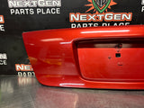 04-06 PONTIAC GTO LICENSE PLATE TRUNK FILLER PANEL SPICE RED OEM #1293