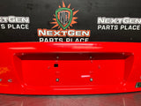 04-06 PONTIAC GTO LICENSE PLATE TRUNK FILLER PANEL TORRID RED OEM  #1025