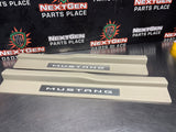 2011 FORD MUSTANG GT LH AND RH ILLUMINATED DOOR SILL TRIM SET TAN OEM #1357