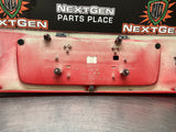 04-06 PONTIAC GTO LICENSE PLATE TRUNK FILLER PANEL TORRID RED OEM #1027