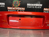 04-06 PONTIAC GTO LICENSE PLATE TRUNK FILLER PANEL SPICE RED OEM #1293