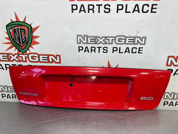 04-06 PONTIAC GTO LICENSE PLATE TRUNK FILLER PANEL TORRID RED #3802