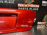 04-06 PONTIAC GTO LICENSE PLATE TRUNK FILLER PANEL SPICE RED OEM #1293