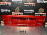 04-06 PONTIAC GTO LICENSE PLATE TRUNK FILLER PANEL SPICE RED OEM #1293