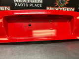 04-06 PONTIAC GTO LICENSE PLATE TRUNK FILLER PANEL TORRID RED OEM #1027