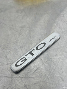 04-06 PONTIAC GTO AIR BAG DASHBOARD BADGE EMBLEM USED OEM